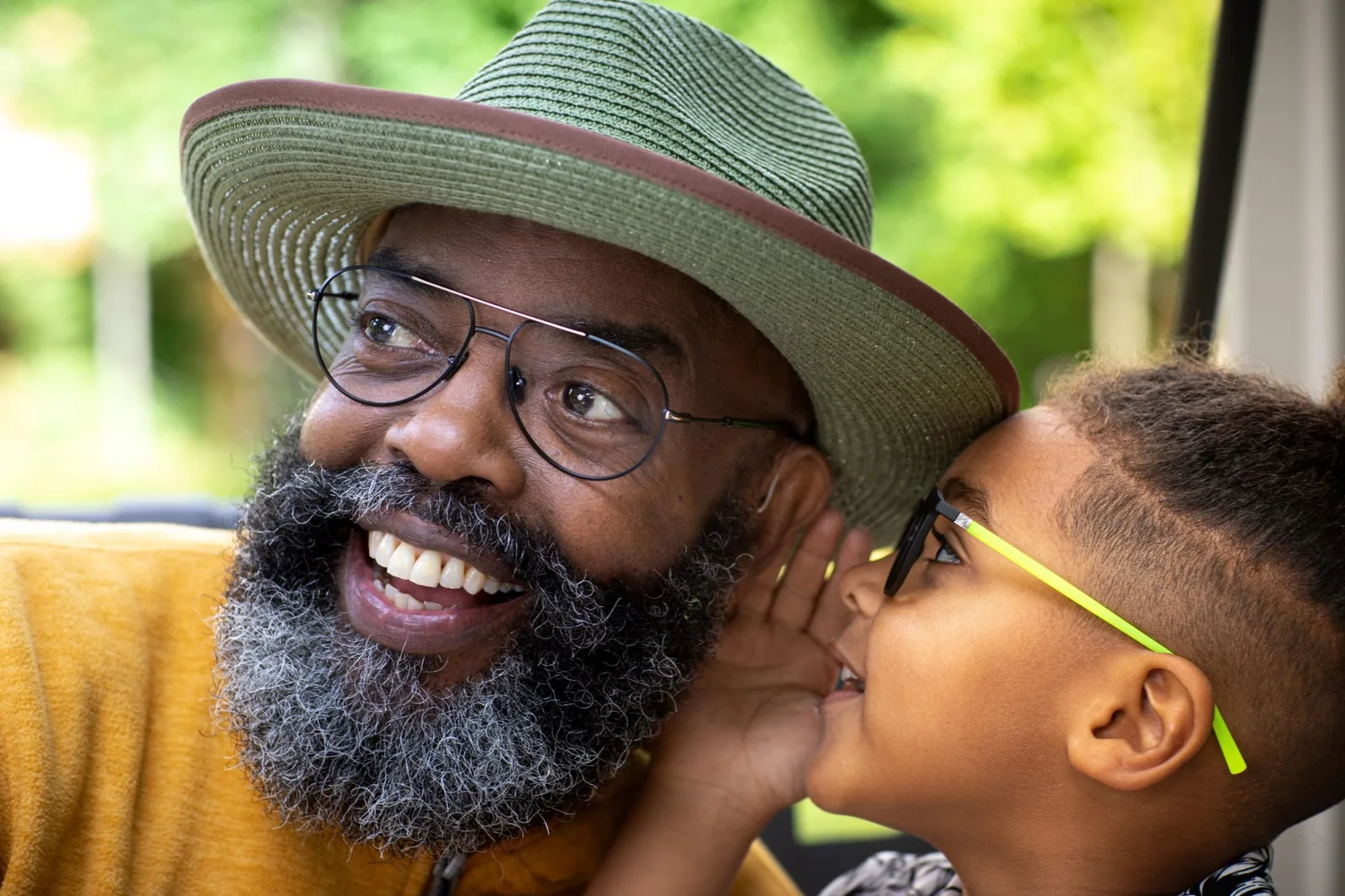 Family member speaking clearly to a person with hearing aids